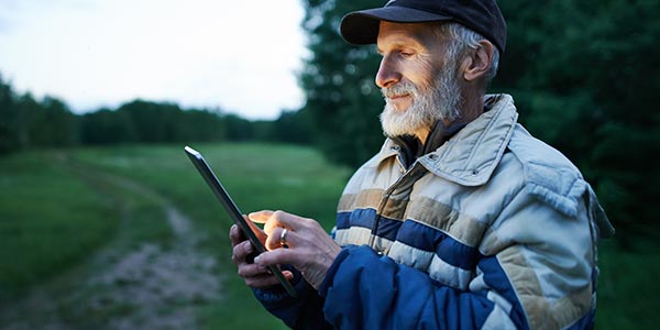 farmer using tablet in field